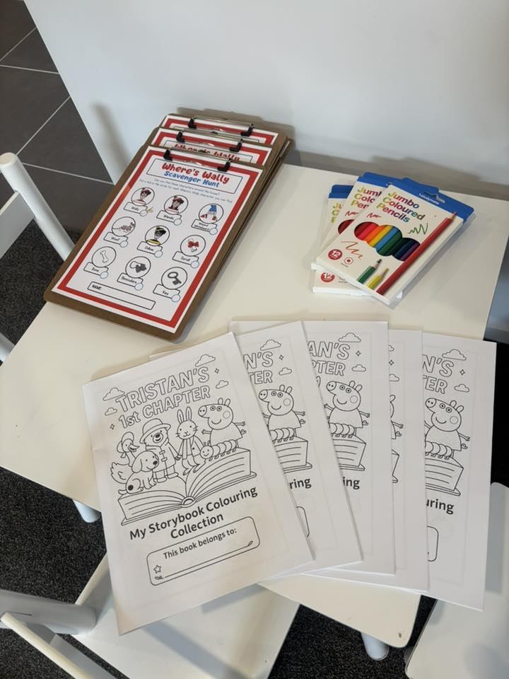 Children's activity set with Where's Wally scavenger hunt clipboards, Peppa Pig coloring books, and colored pencils.