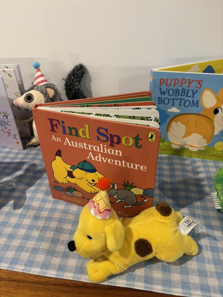 Find Spot An Australian Adventure board book with a yellow Spot plush toy wearing a party hat in front.