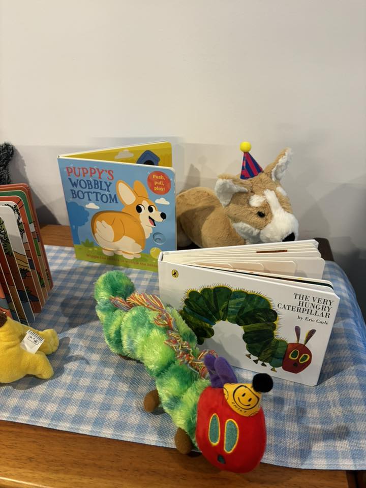 Puppy's Wobbly Bottom and The Very Hungry Caterpillar board books paired with matching plush character toys.