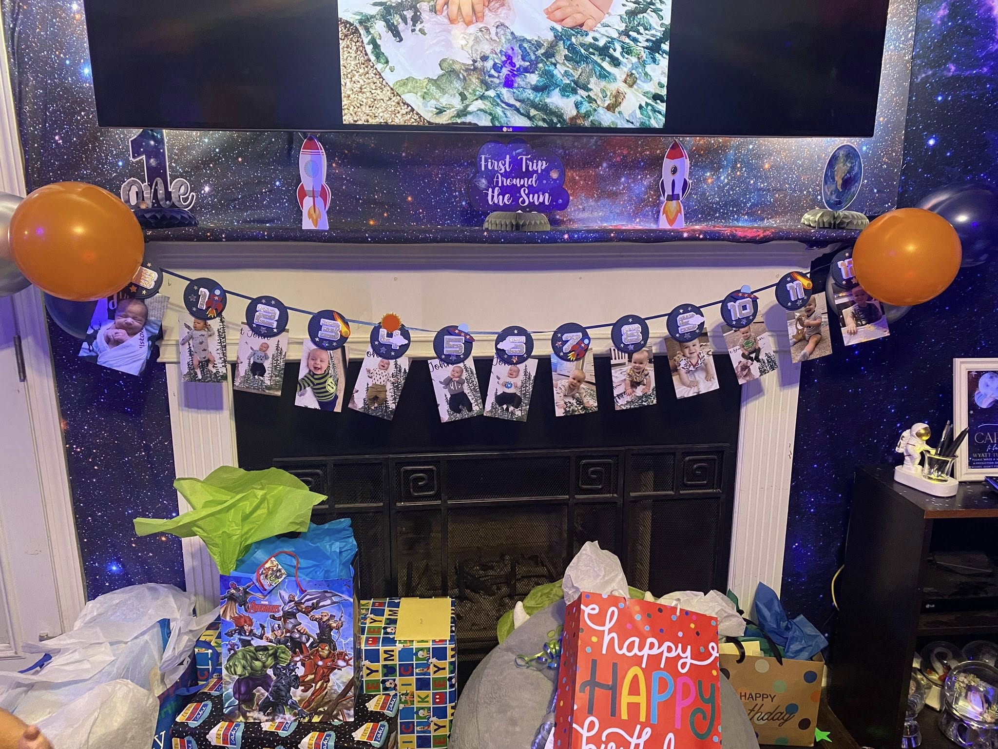 First trip around the sun space-themed birthday banner with 12 monthly photo milestones.