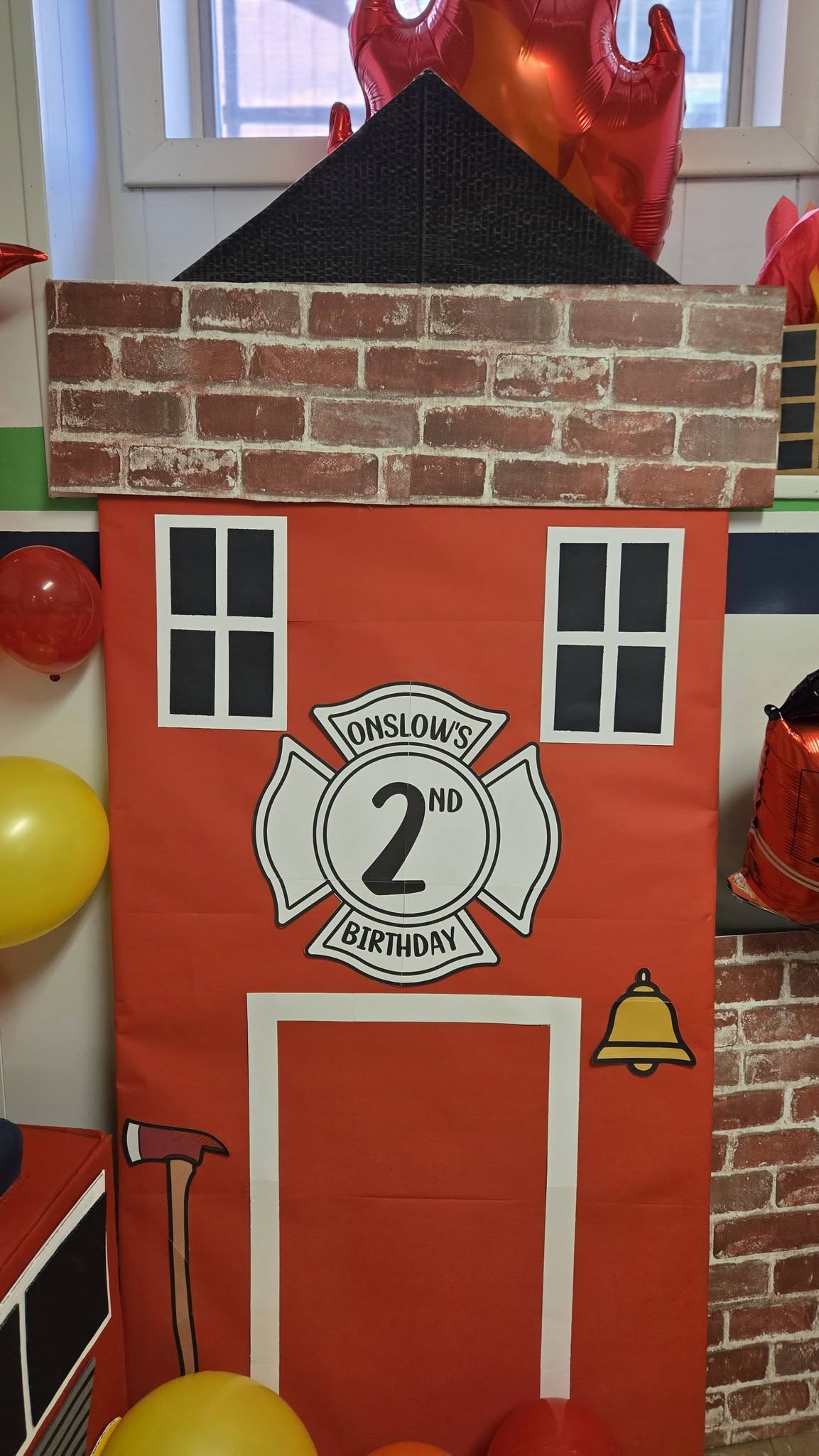 DIY fire station birthday party decoration for Onslow's 2nd birthday