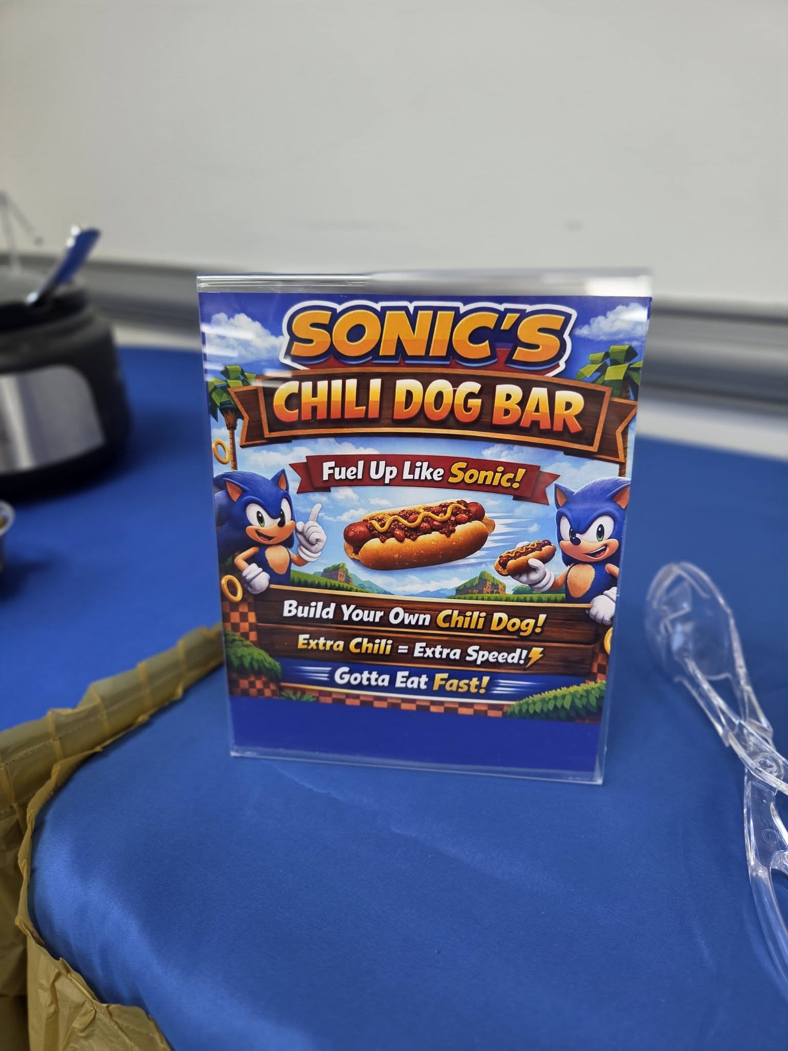 Sonic the Hedgehog themed chili dog bar sign featuring the headline Fuel Up Like Sonic!