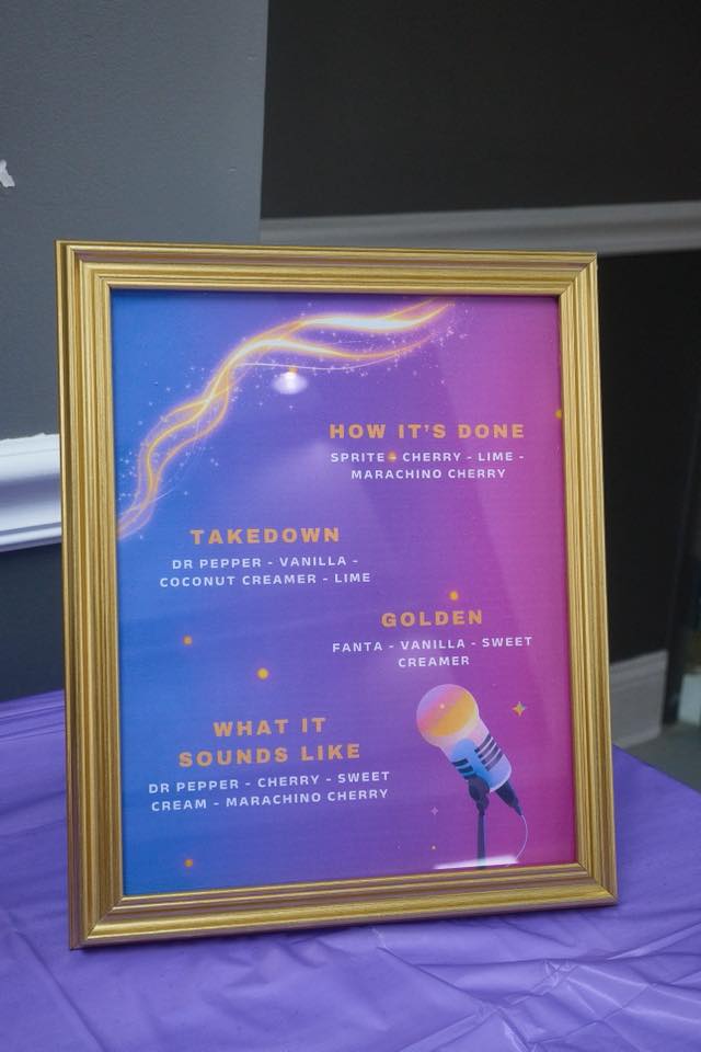 Framed menu sign listing custom soda combinations including Takedown, Golden, and What It Sounds Like.