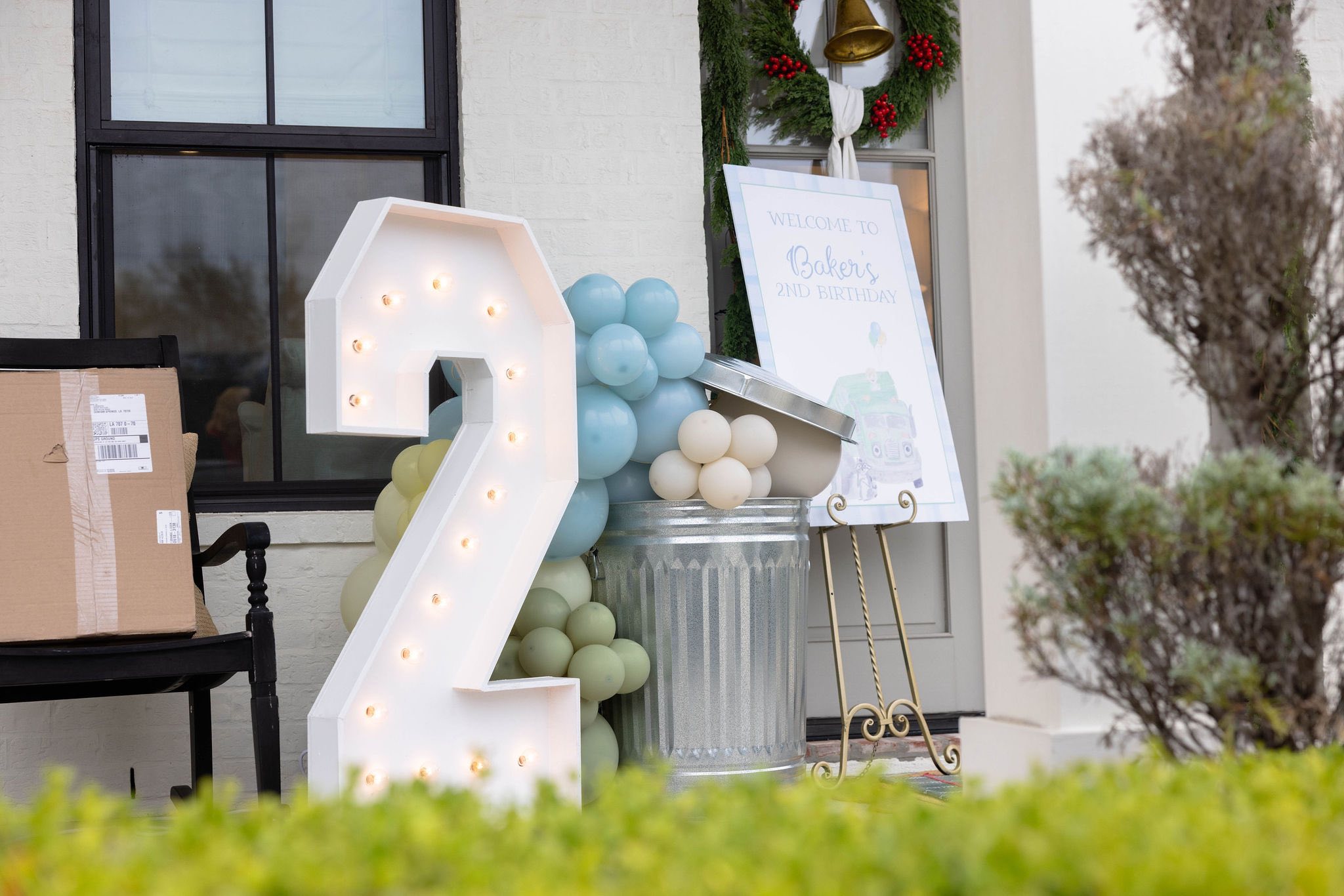 Light-up number 2 marquee prop displayed for a 2nd birthday celebration.