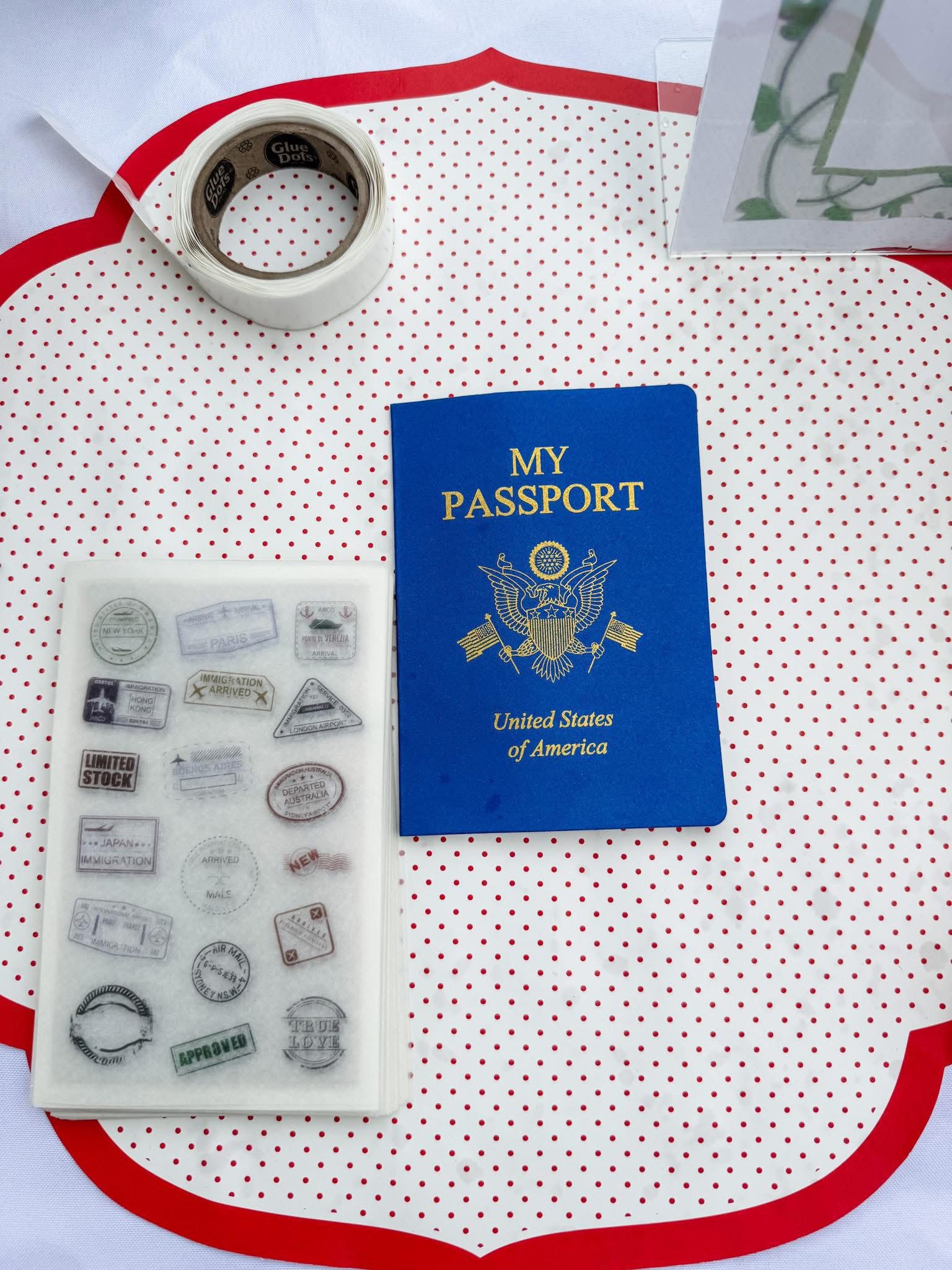 Blue United States My Passport notebook with a sticker sheet of travel stamps and glue dots.