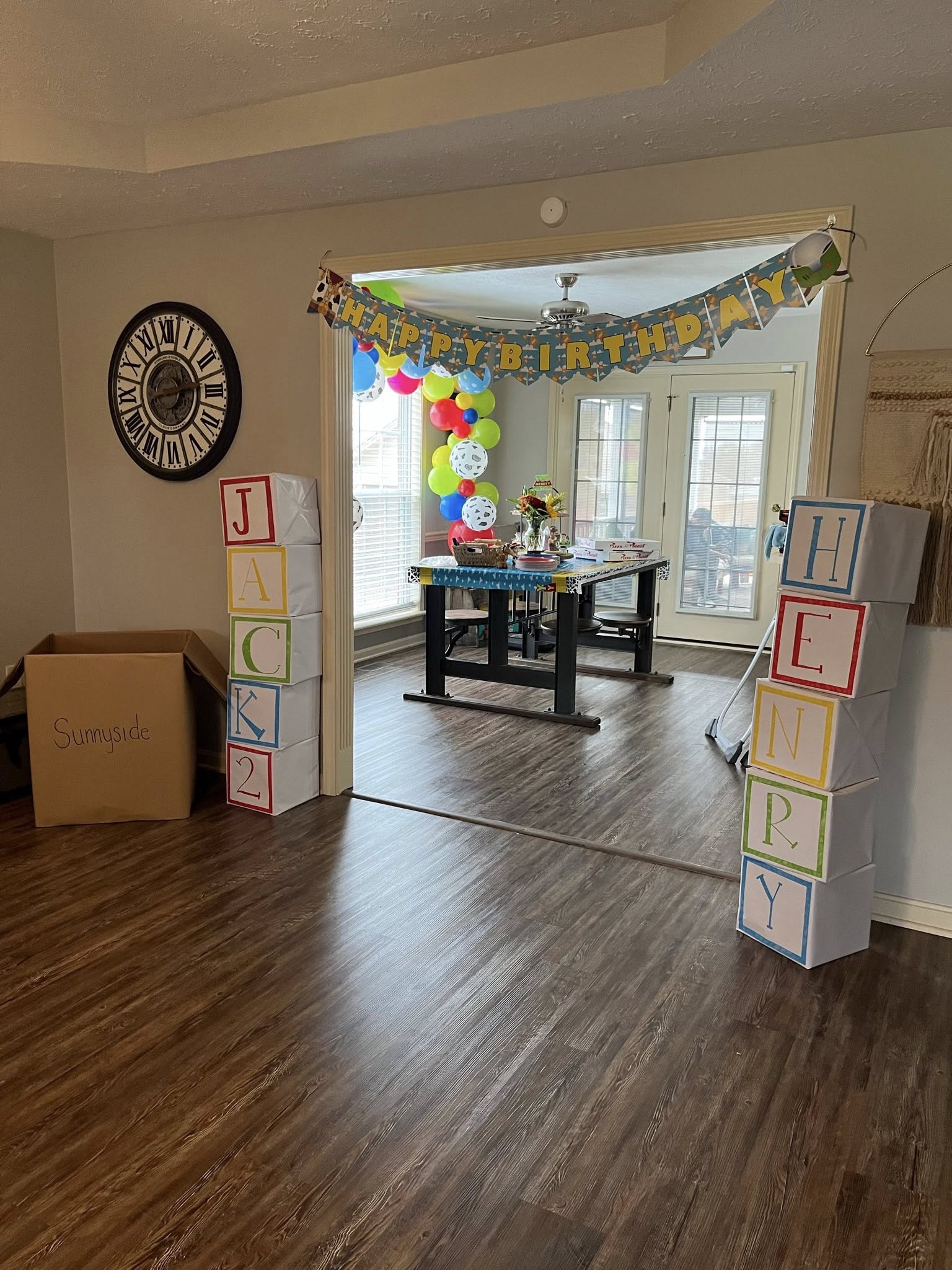 Toy Story inspired birthday party decorations with letter blocks spelling Jack and Henry