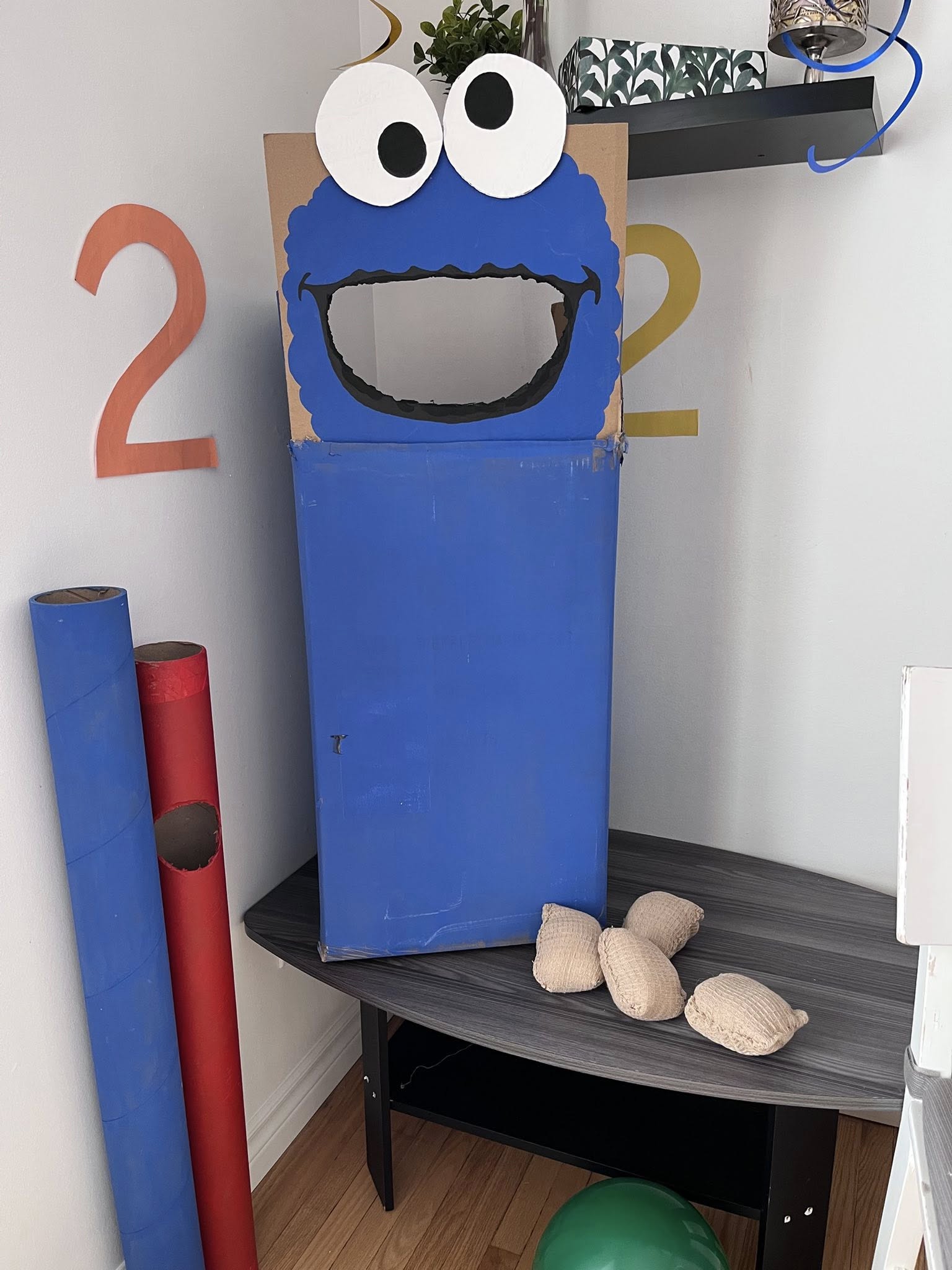 DIY blue Cookie Monster cardboard box bean bag toss game for birthday party