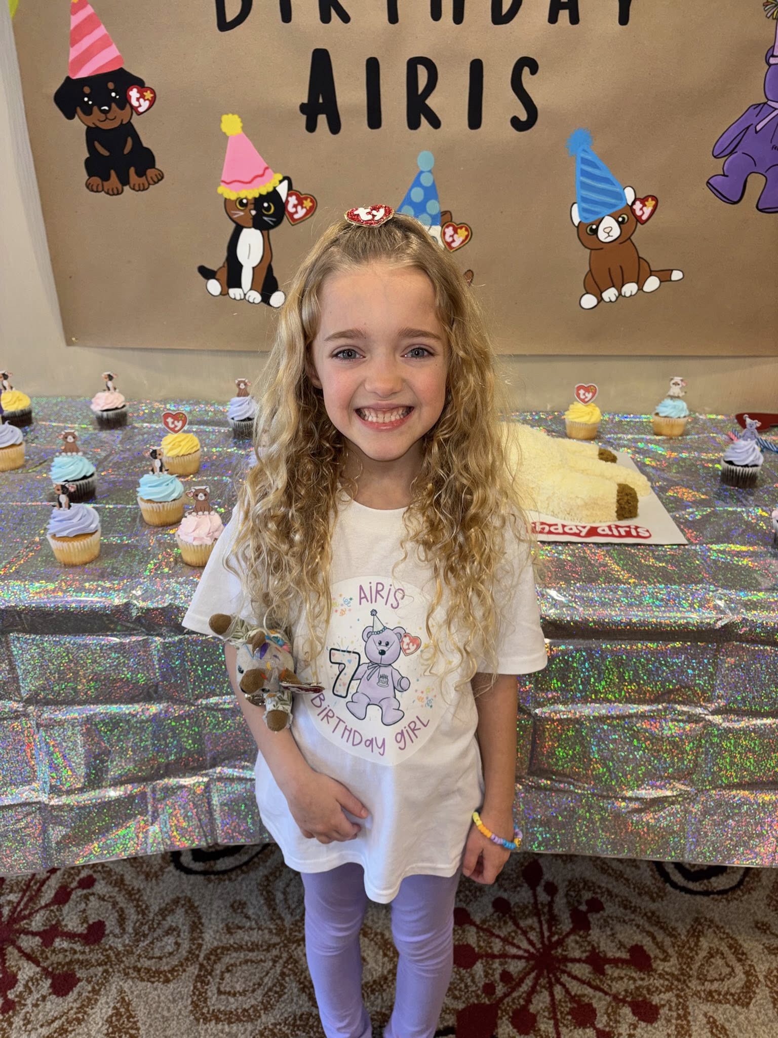 Young girl celebrating her 7th birthday wearing a custom Ty Beanie Baby themed shirt
