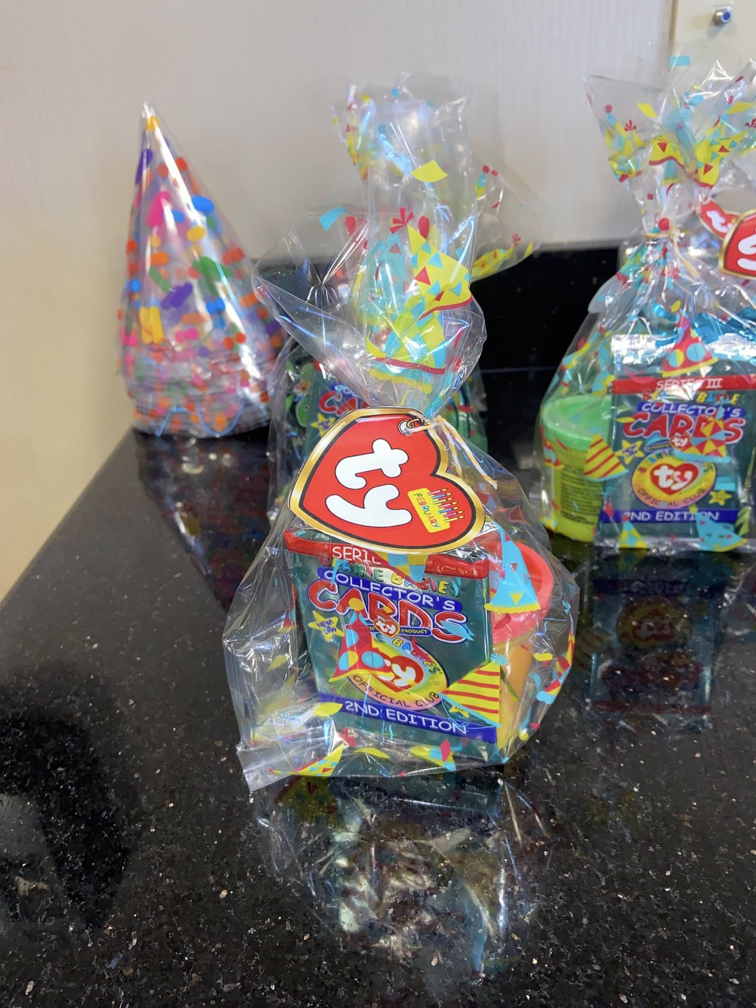 Party favor bag containing Ty Beanie Babies Collector's Cards 2nd Edition with a February birthday heart tag.