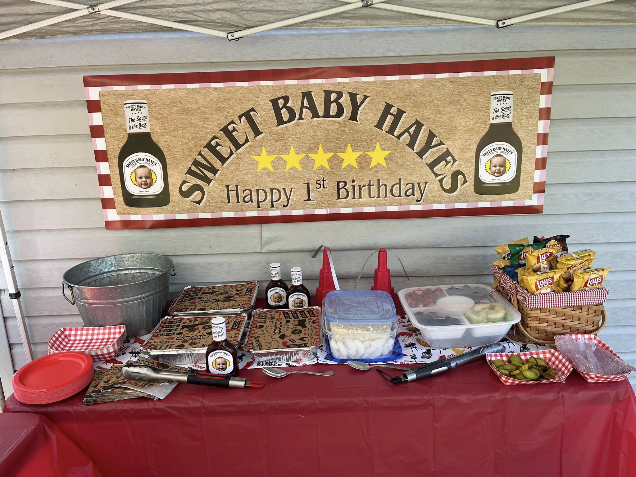 Custom birthday party banner for Sweet Baby Hayes 1st Birthday featuring barbeque sauce theme.