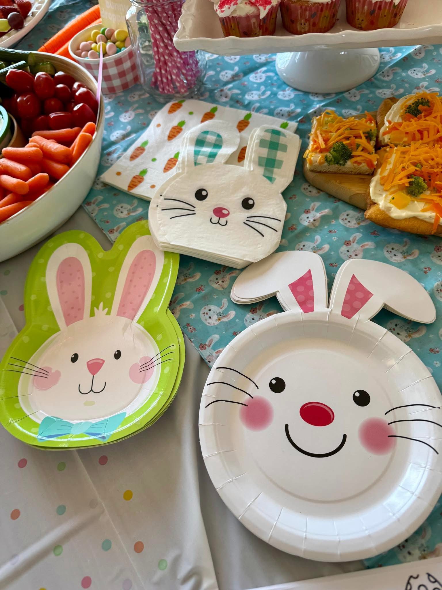 Easter themed bunny plates and napkins with party food spreads