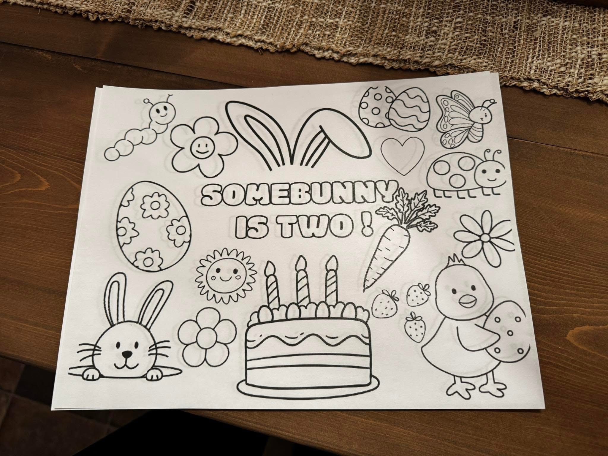 Easter-themed birthday coloring page for a two-year-old featuring a cake, bunny, and spring designs.