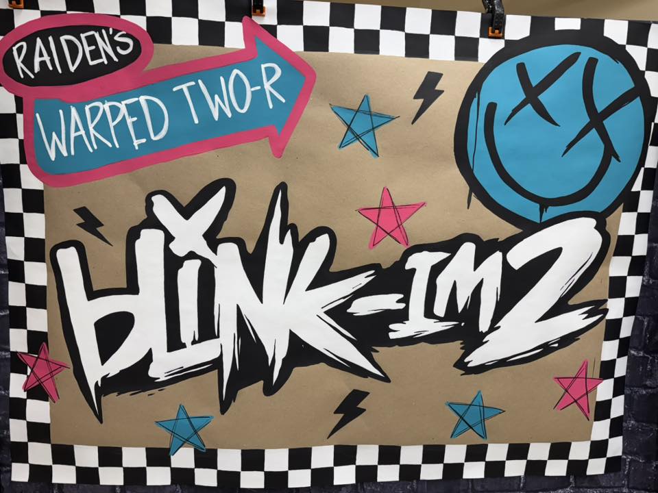Handmade Blink-182 themed birthday sign titled Raiden's Warped Two-r with a punk rock aesthetic.