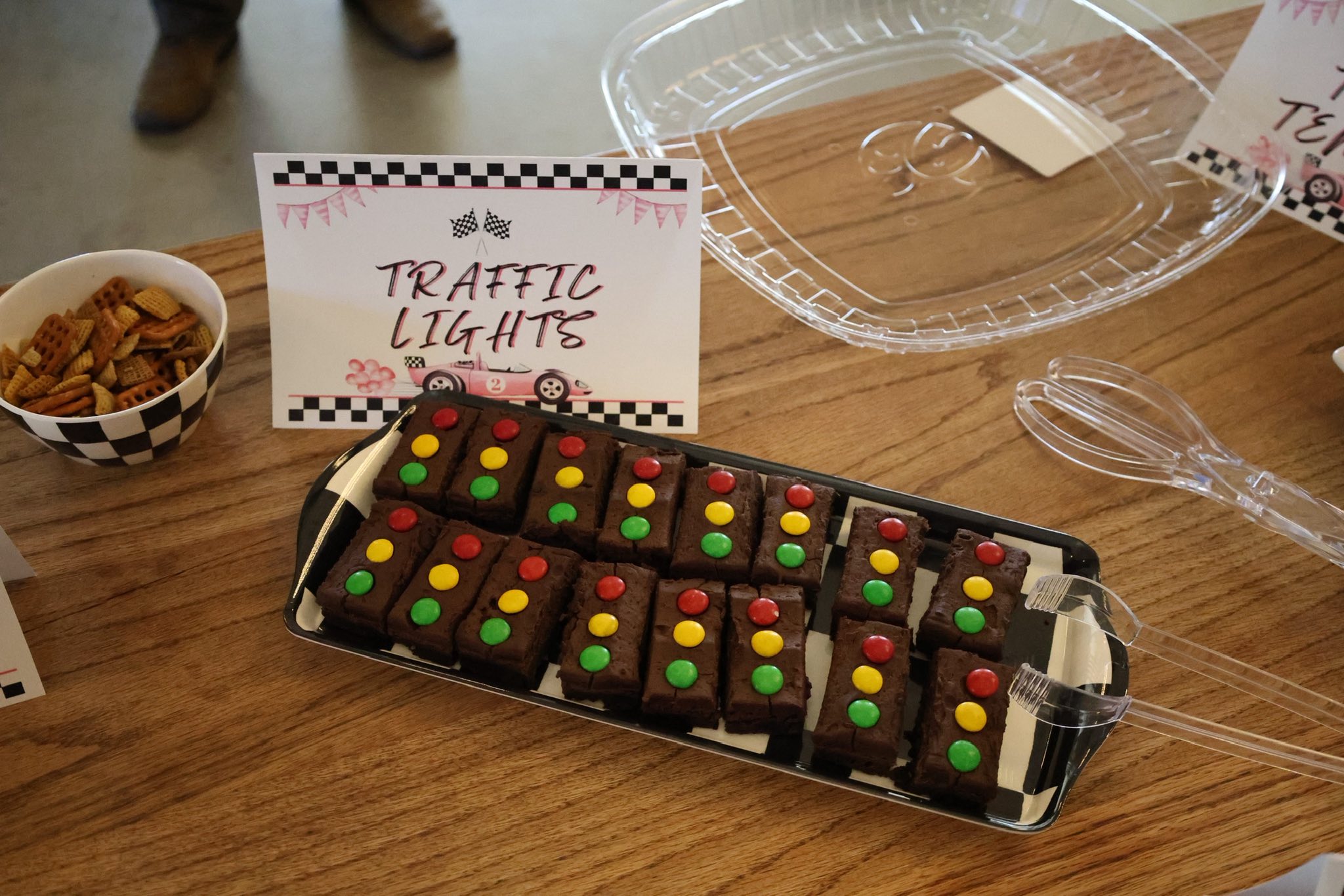 Brownie treats decorated with red, yellow, and green candies to resemble traffic lights for a race car party.