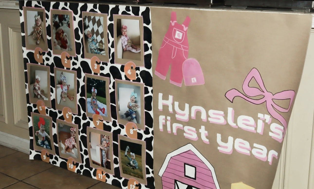 Hynslei's first year milestone board with 12 monthly baby photos on a cow print background.