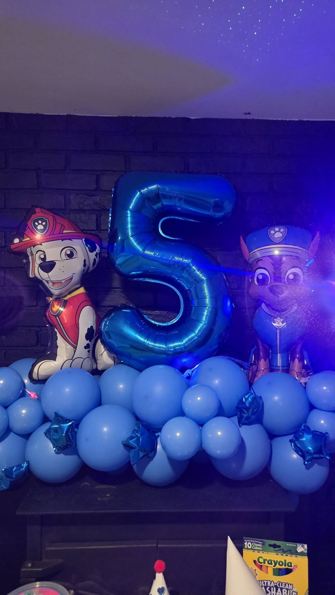 Blue number five balloon decorated with PAW Patrol Marshall and Chase character foil balloons
