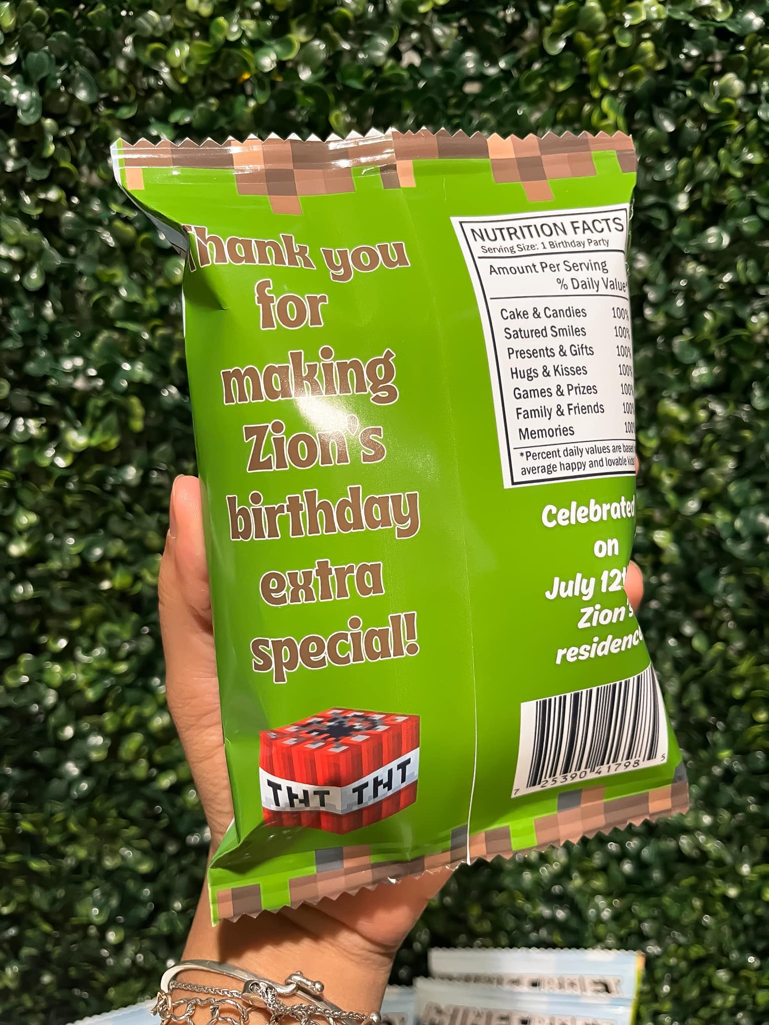 Custom Minecraft-themed party favor bag with a TNT block graphic and a nutrition facts label listing birthday activities.