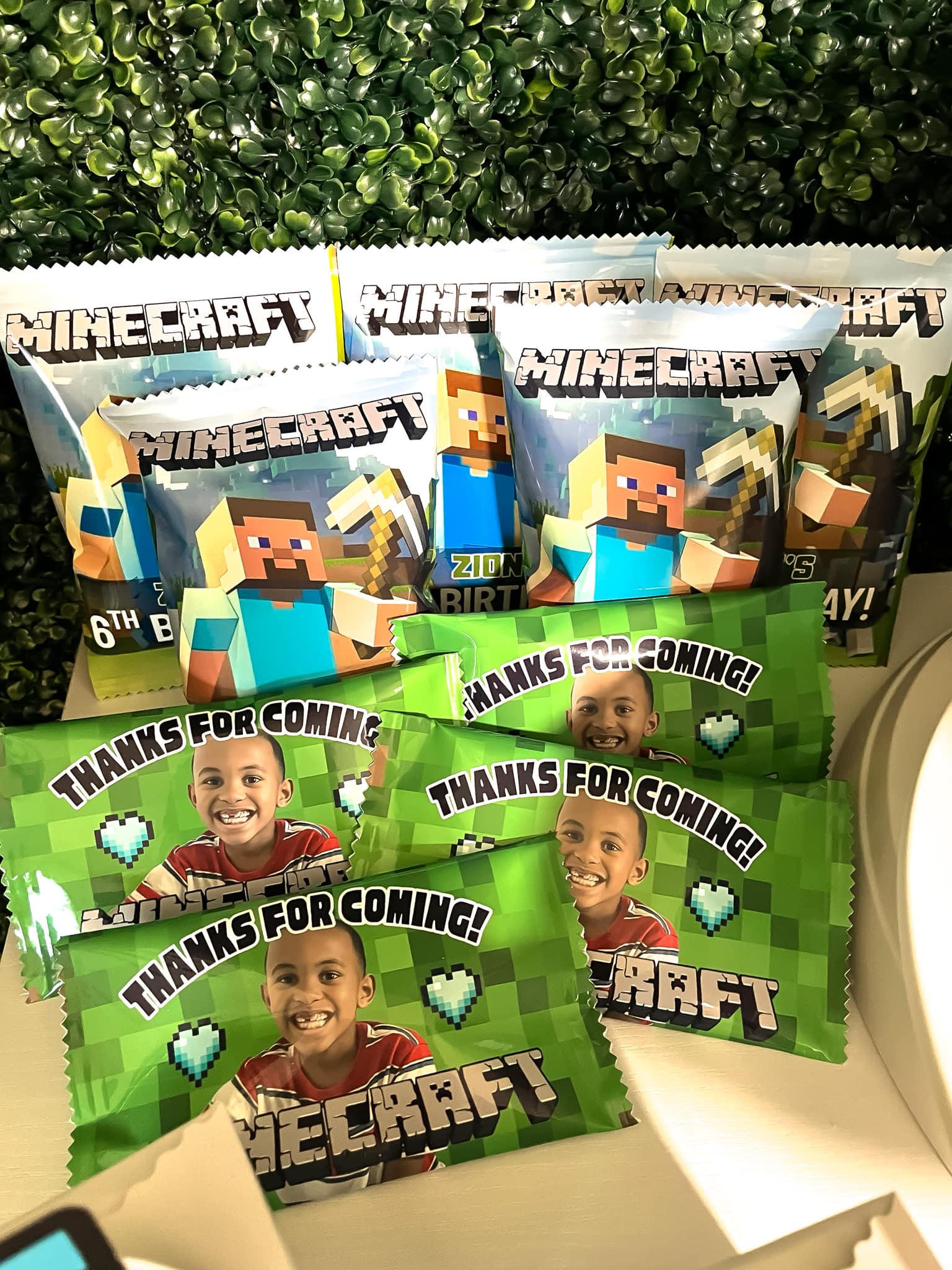 Custom Minecraft-themed party favor bags featuring a photo of a child and text saying thanks for coming