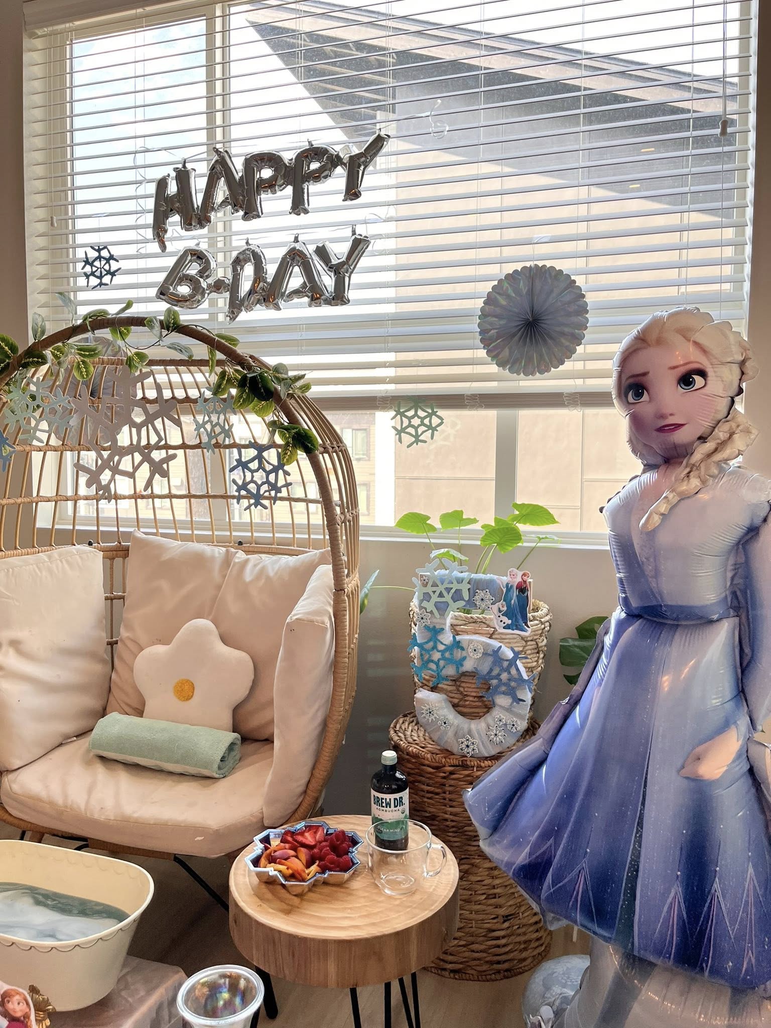 Frozen themed 5th birthday party decor with Elsa balloon and Happy B-Day letter balloons