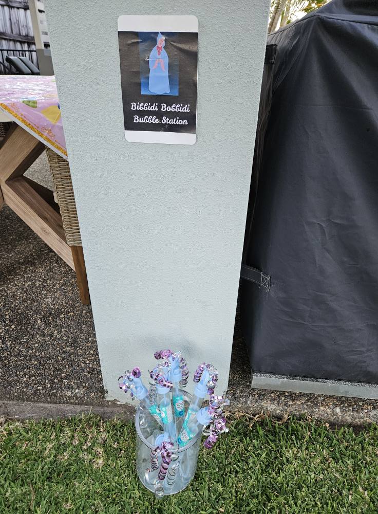 Bibbidi Bobbidi Bubble Station sign with a jar of bubble wands for a themed party