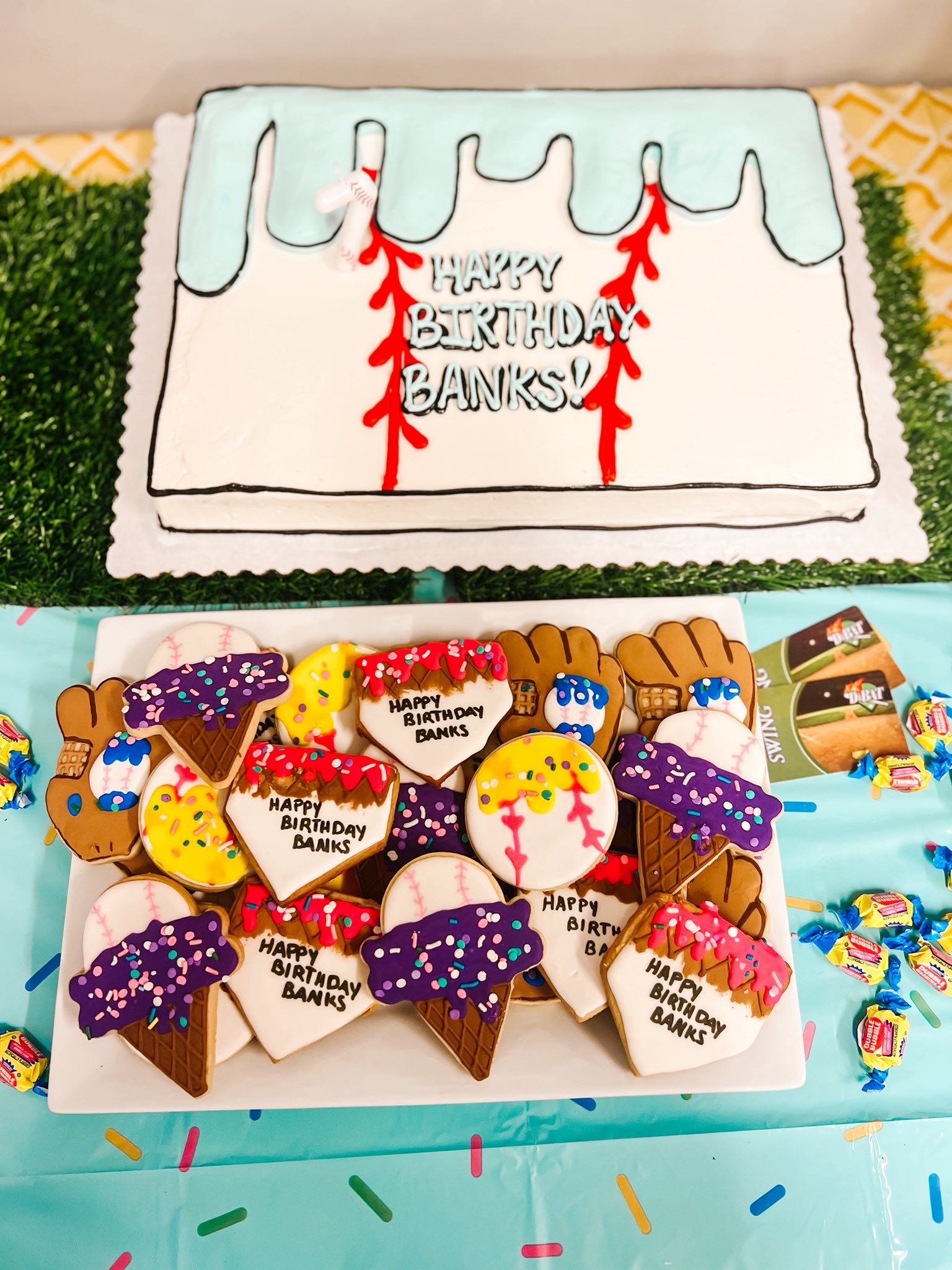 Baseball-themed birthday cake and decorated sugar cookies featuring baseballs, gloves, and ice cream cones.