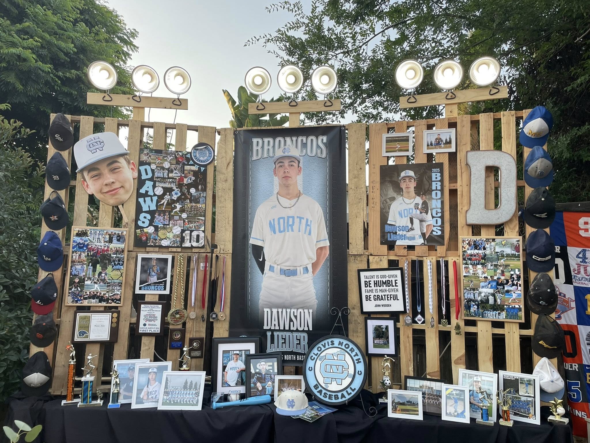 Senior night display board for high school baseball player Dawson Lieder featuring photos, medals, and team memorabilia.