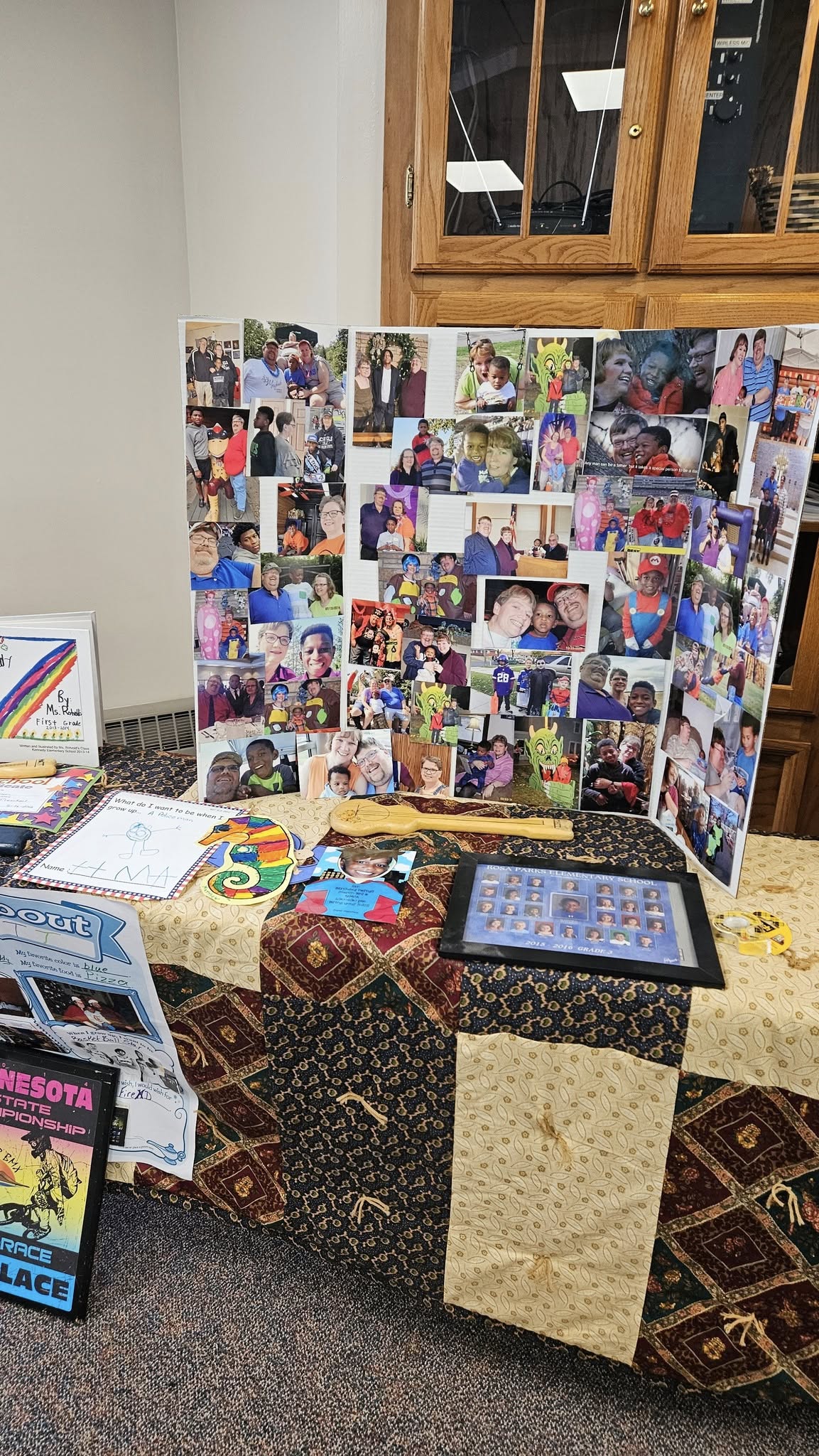 A display board featuring many photos from Rosa Parks Elementary School including a picture.
