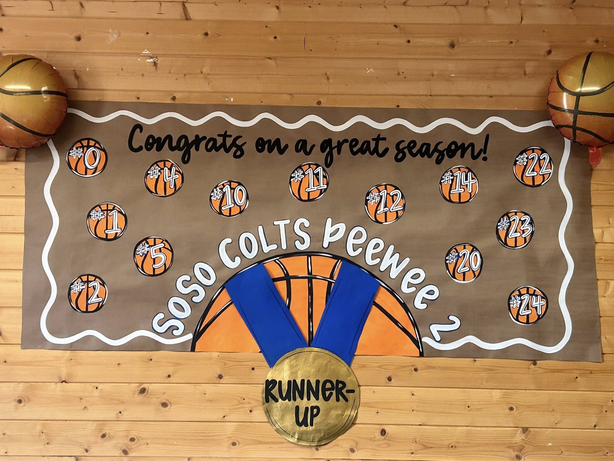 Soso Colts Peewee runner-up basketball team banner celebrating the season with jersey numbers.