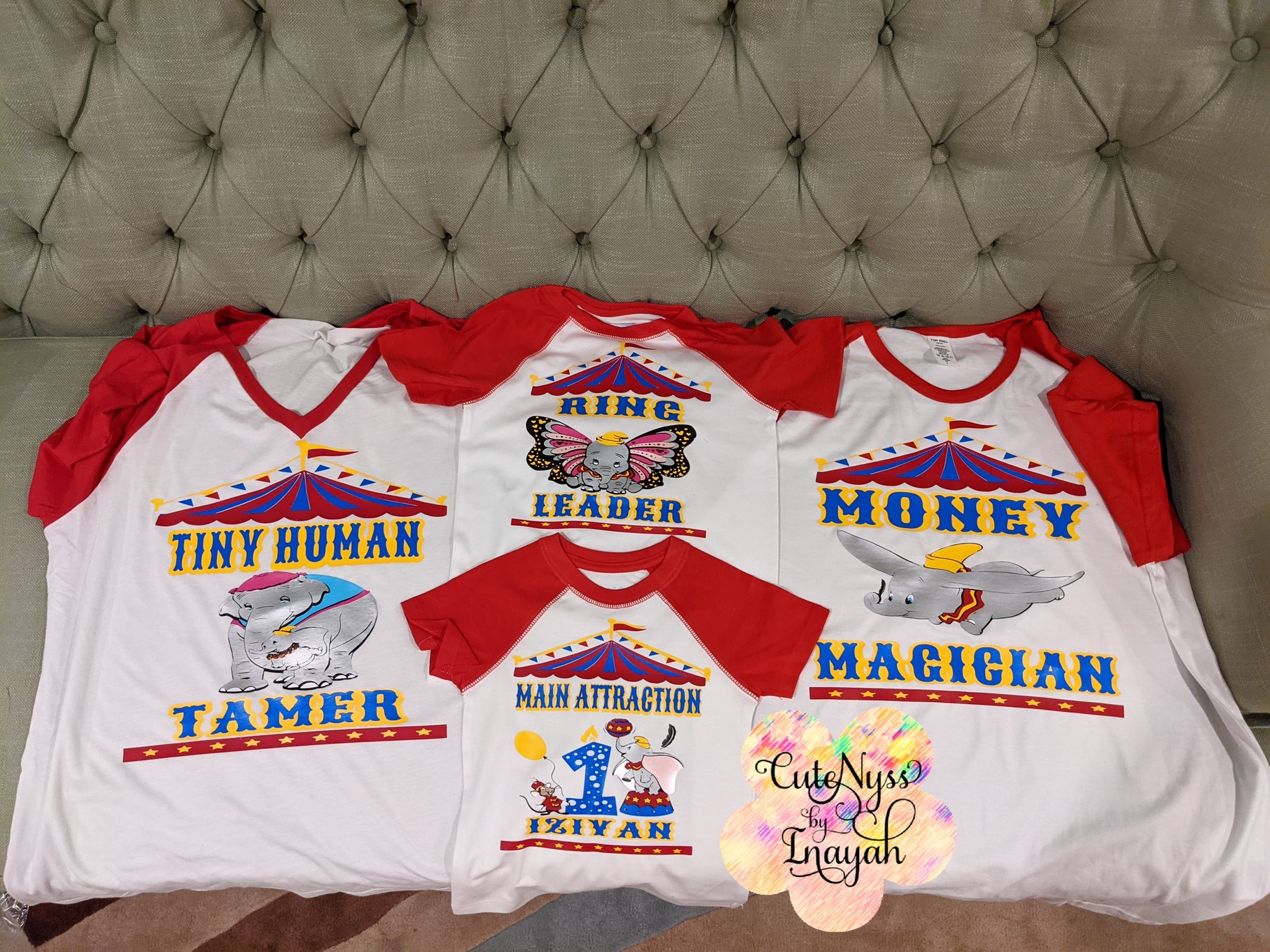 Set of four Dumbo-themed circus birthday family t-shirts with red sleeves featuring Ring Leader, Tamer, and birthday designs.
