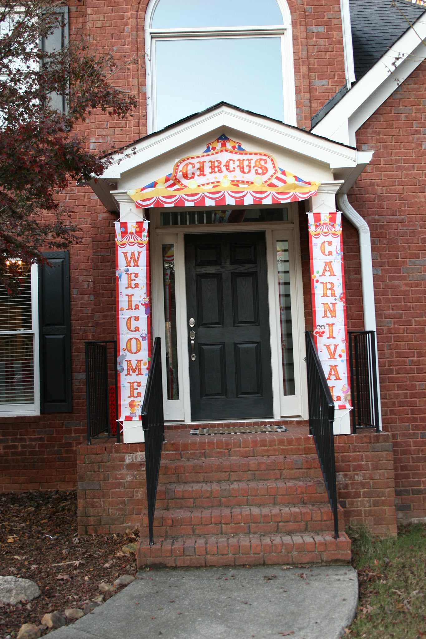 Front door decorated with Welcome Circus Carnival hanging banners