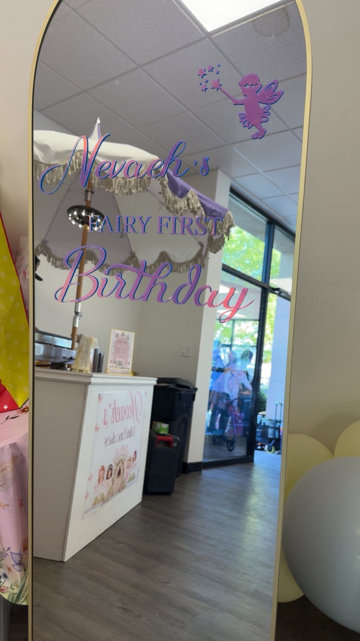 Arched floor mirror with iridescent fairy and 'Nevaeh's Fairy First Birthday' vinyl decal.