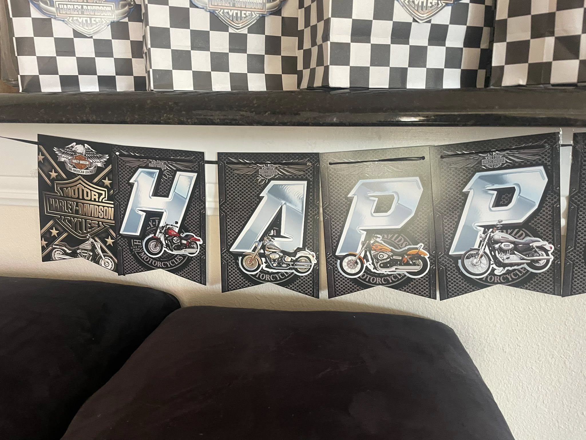 Harley-Davidson themed Happy birthday banner featuring motorcycle imagery and metallic lettering.