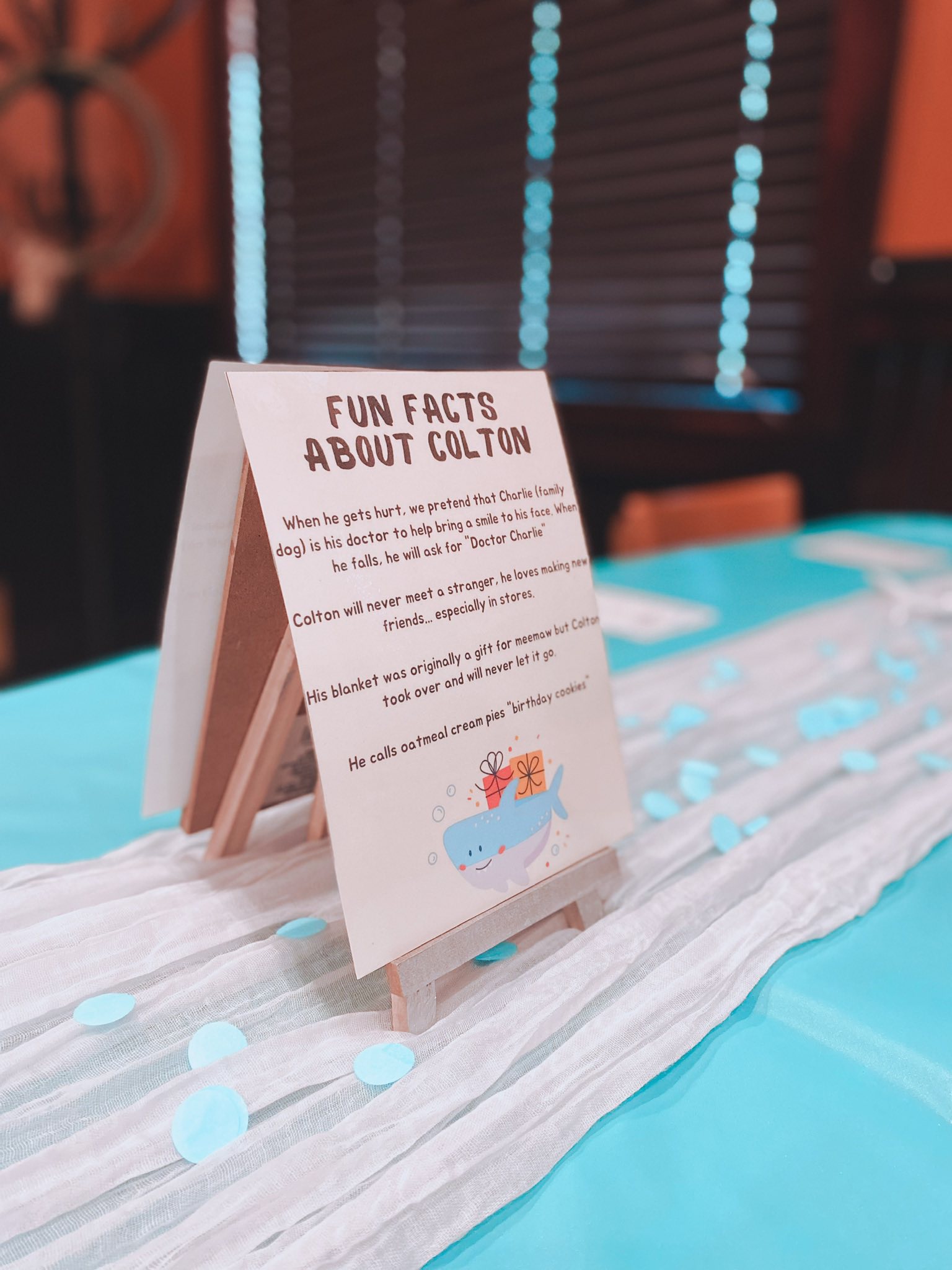 Fun Facts About Colton card on a mini easel as part of birthday table decor.