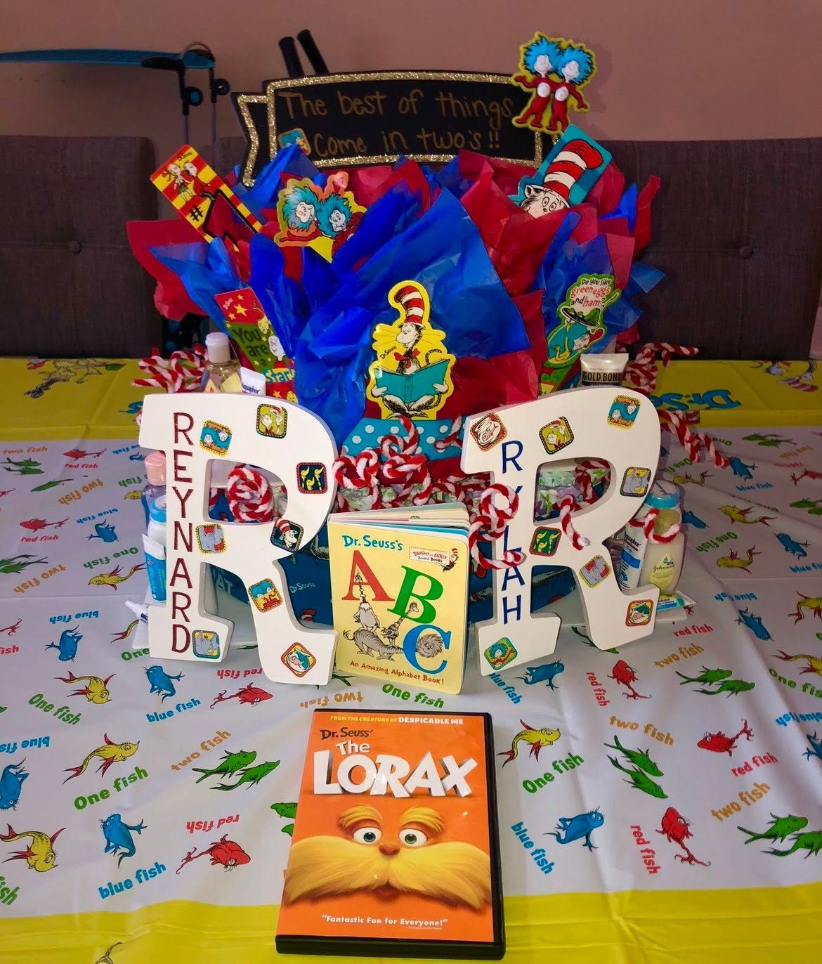 Dr. Seuss themed gift basket featuring custom letters spelling names, a Dr. Seuss ABC book, and The Lorax DVD