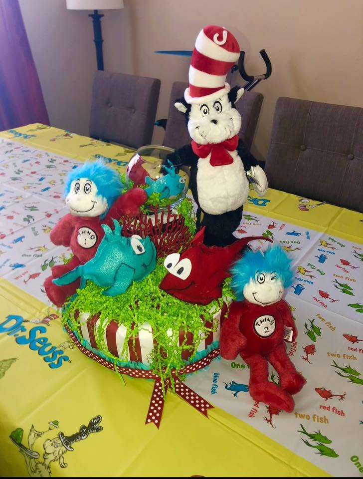 Dr. Seuss themed table centerpiece with The Cat in the Hat and Thing 1 and Thing 2 plush toys.