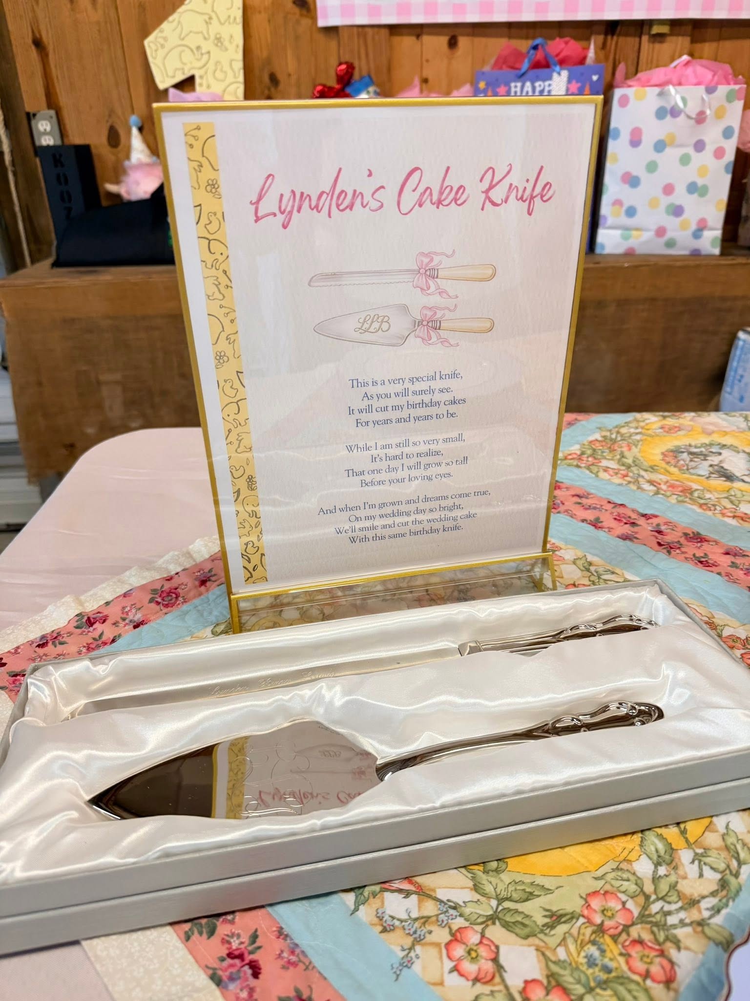 Engraved cake knife and server set displayed with a personalized keepsake poem sign.