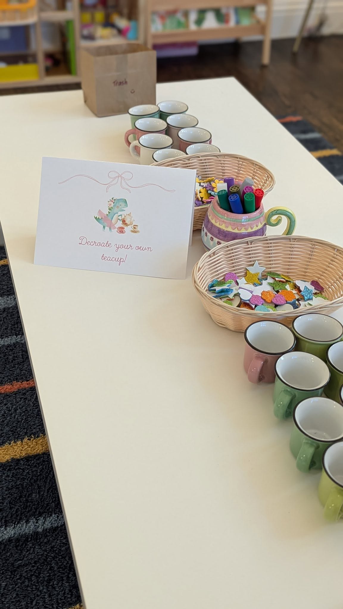 Decorate your own teacup craft station with small mugs and decorative stickers