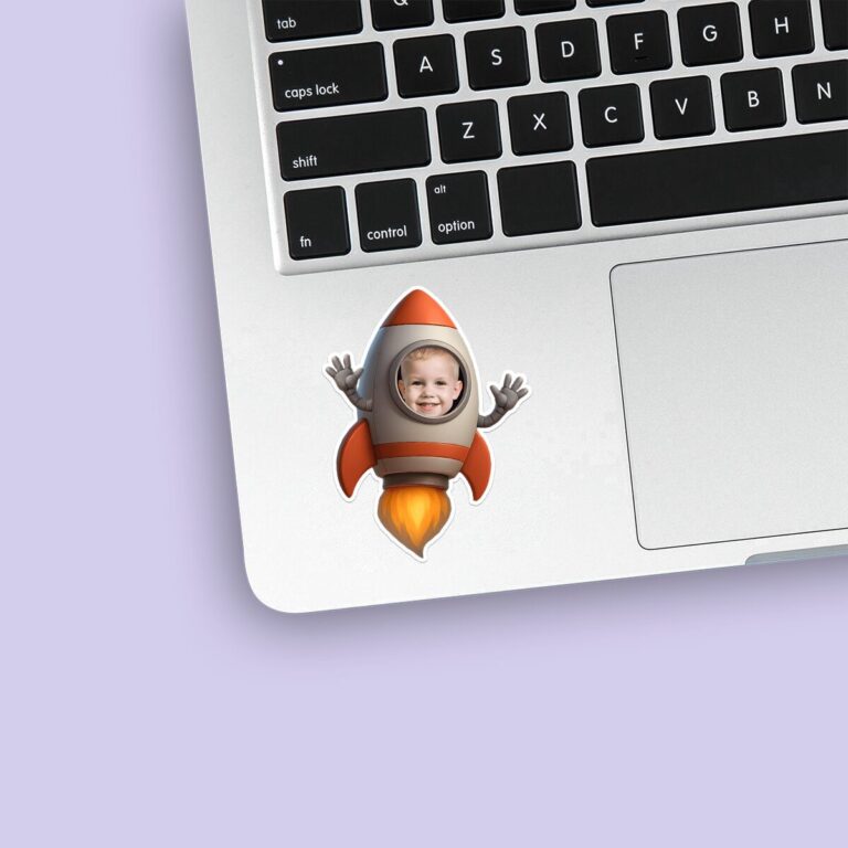 Custom Child Astronaut Riding Inside a Rocket Face Cutout – Sticker Custom Child Astronaut Riding Inside a Rocket Face Cutout shown on a sticker mockup