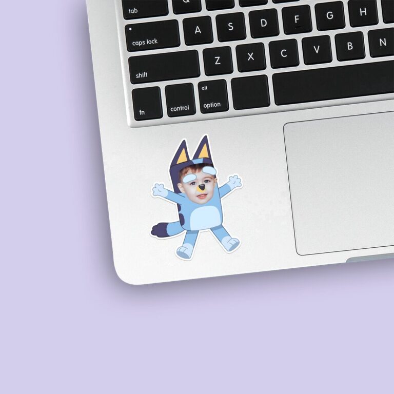 Custom Blue Cartoon Dog Costume Character Face Cutout – Sticker Custom Blue Cartoon Dog Costume Character Face Cutout shown on a sticker mockup