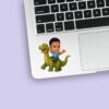 Custom Rider on a Green Long-Neck Dinosaur Face Cutout – Sticker Custom Rider on a Green Long-Neck Dinosaur Face Cutout shown on a sticker mockup