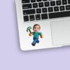 Custom Pixel-Style Miner with Pickaxe Face Cutout – Sticker Custom Pixel-Style Miner with Pickaxe Face Cutout shown on a sticker mockup