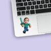 Custom Pixel-Style Adventurer with Sword Face Cutout – Sticker Custom Pixel-Style Adventurer with Sword Face Cutout shown on a sticker mockup