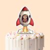 Custom Astronaut in a Launching Rocket Face Cutout – Cake Topper Custom Astronaut in a Launching Rocket Face Cutout shown on a cake topper mockup
