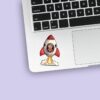 Custom Astronaut in a Launching Rocket Face Cutout – Sticker Custom Astronaut in a Launching Rocket Face Cutout shown on a sticker mockup