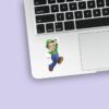Custom Green-Capped Game Hero Jumping Face Cutout – Sticker Custom Green-Capped Game Hero Jumping Face Cutout shown on a sticker mockup