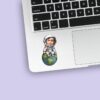 Custom Astronaut Seated on Earth Face Cutout – Sticker Custom Astronaut Seated on Earth Face Cutout shown on a sticker mockup