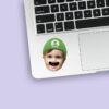Custom Green Game-Hero Cap Face Cutout – Sticker Custom Green Game-Hero Cap Face Cutout shown on a sticker mockup