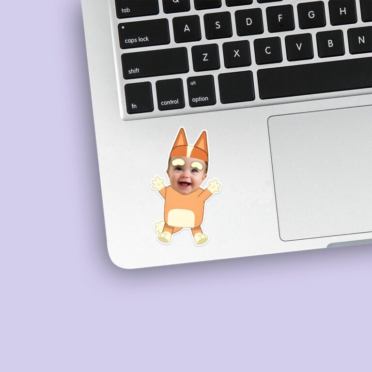 Custom Baby in an Orange Cartoon-Dog Costume Face Cutout – Sticker Custom Baby in an Orange Cartoon-Dog Costume Face Cutout shown on a sticker mockup