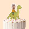 Custom Child Riding a Green Long-Neck Dinosaur Face Cutout – Cake Topper Custom Child Riding a Green Long-Neck Dinosaur Face Cutout shown on a cake topper mockup