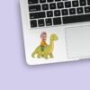 Custom Child Riding a Green Long-Neck Dinosaur Face Cutout – Sticker Custom Child Riding a Green Long-Neck Dinosaur Face Cutout shown on a sticker mockup